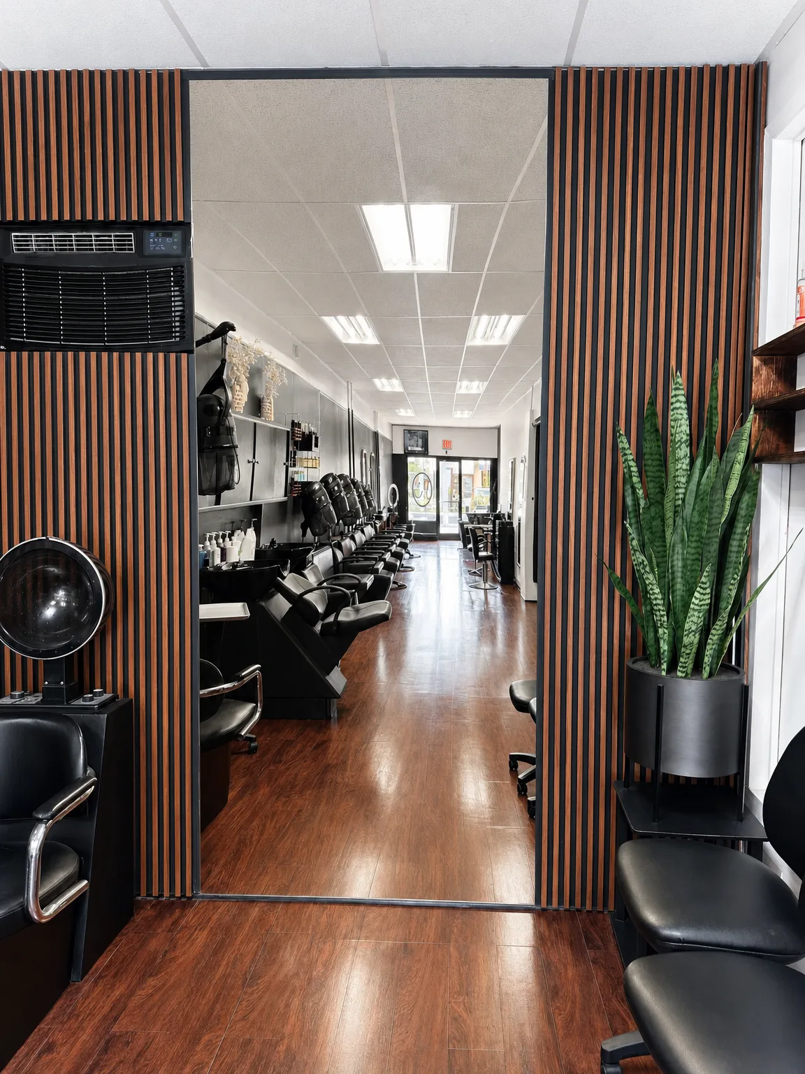 Styling chair and gold-framed lit mirror