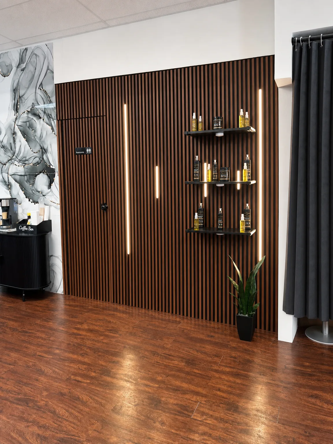 Backlit product shelves on the wood slat wall
